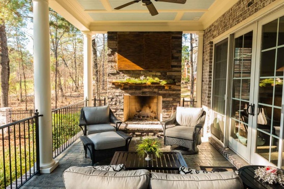 This outdoor fireplace addition in Elgin, SC, boasts a custom-designed ...